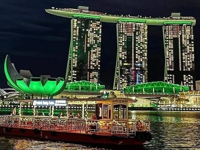 Traditional style tour boat near Marina Bay Sands and ArtScience Museum