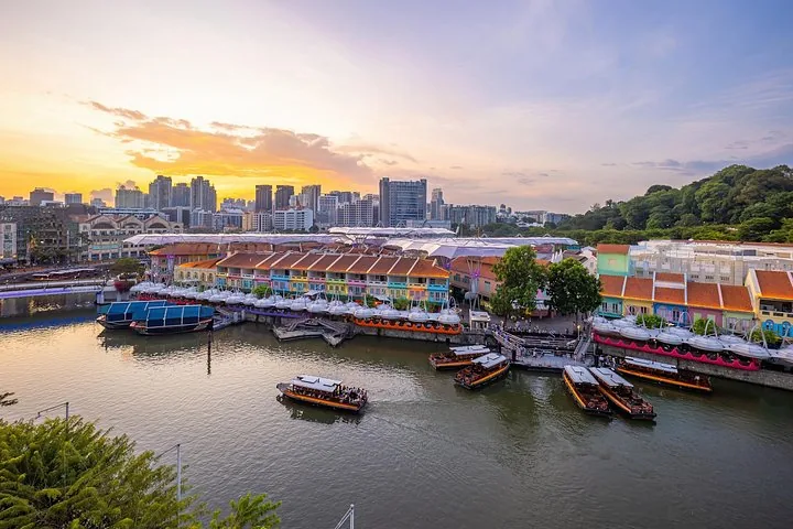 Sunset view of Clarke Quay with tour boats on the Singapore River