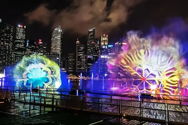 Spectacular colorful light and water fountain show in Marina Bay at night
